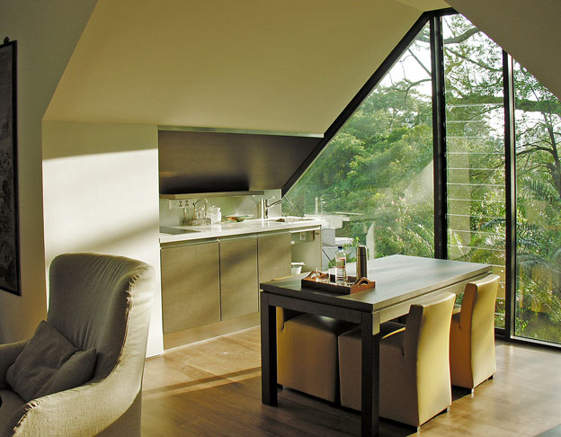 Custom made kitchenette and table and chairs by Meridiani