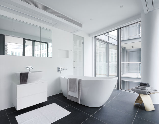 Master bathroom with free standing bathtub and Yanagi Butterfly stool