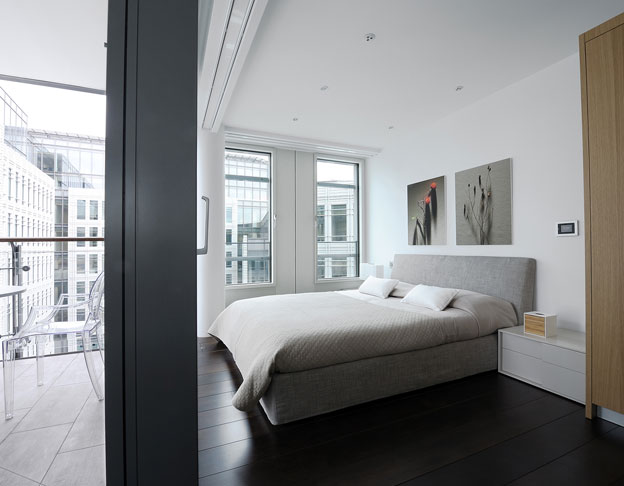 Master bedroom with photos by Marco Bertolini